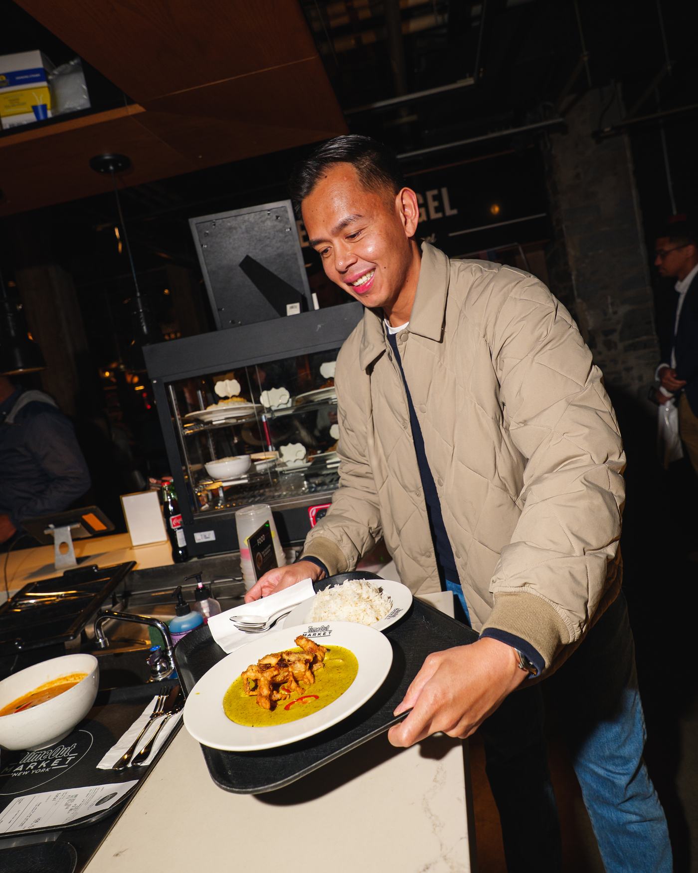 Server presenting a plated dish at the Call Your Shot activation