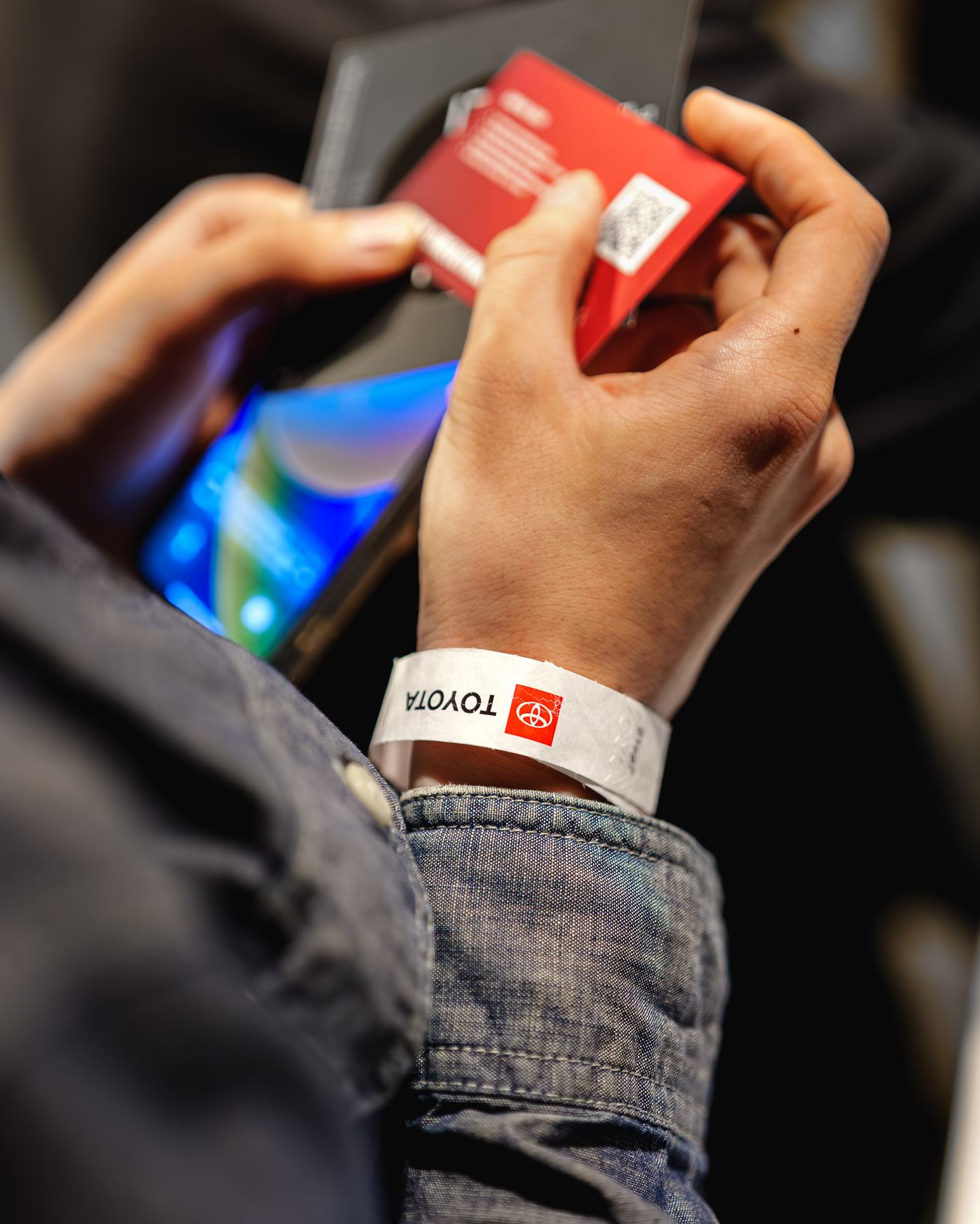 Guest scanning a QR wristband on their phone