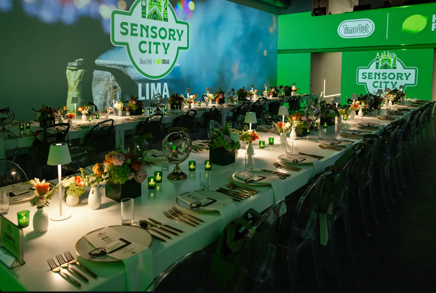 Sensory City long dining table set under green Sensory City signage at Time Out Market New York