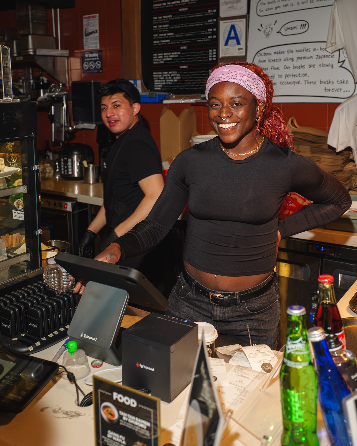 Staff smiling behind the counter at the Call Your Shot activation